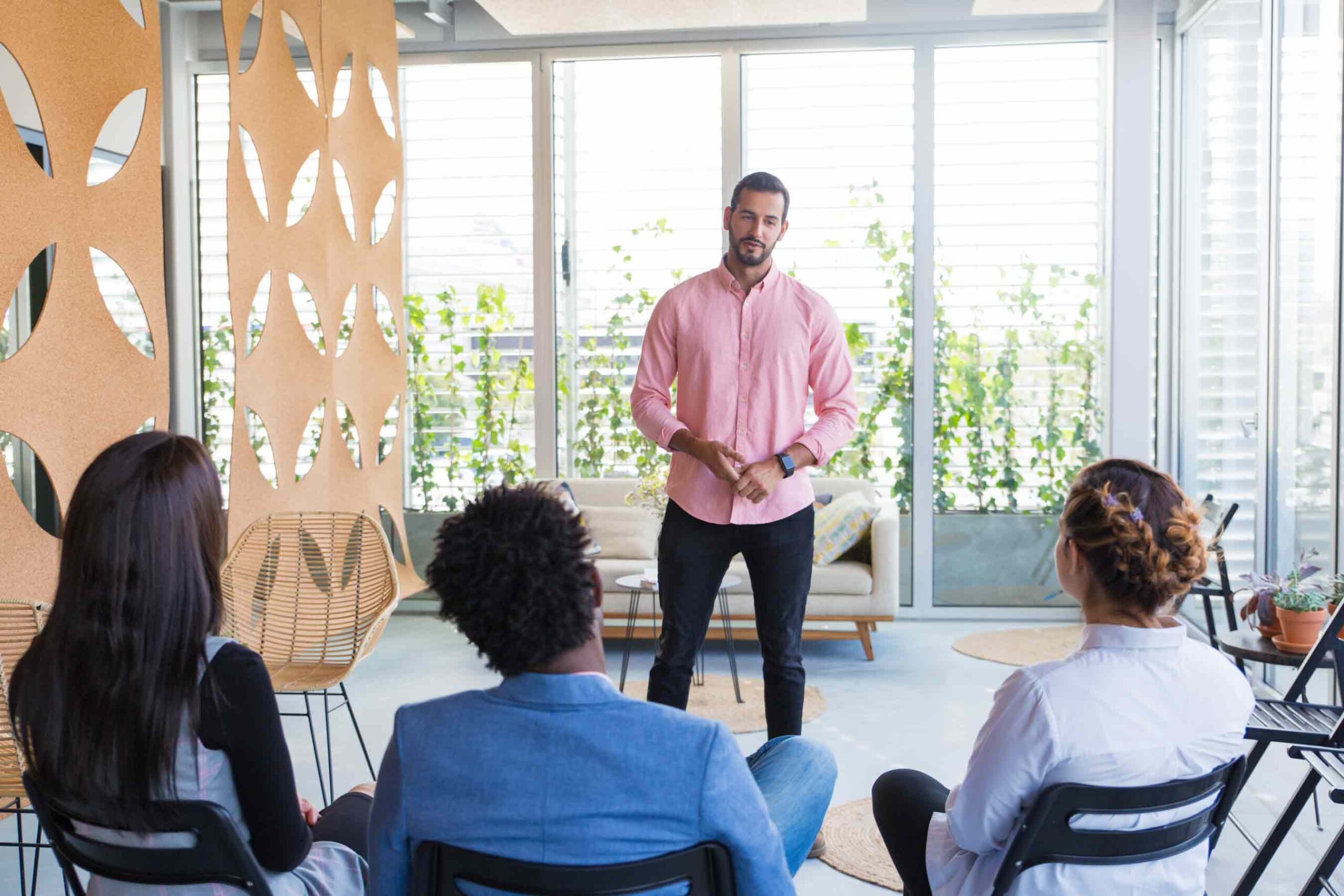 confident male speaker holding seminar
